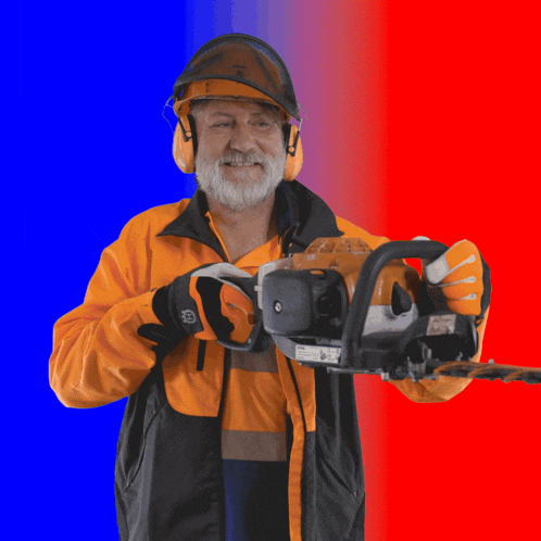 a man wearing a stihl helmet and earbuds