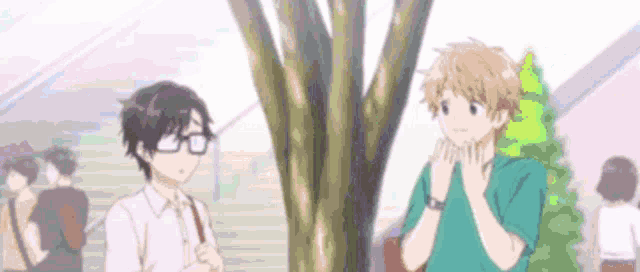 a couple of anime characters standing next to each other under a tree .