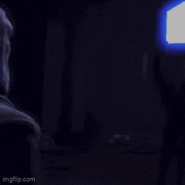 a blurry picture of a person holding a light saber