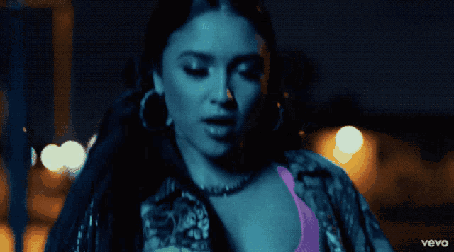 a close up of a woman 's face with the words vevo on the bottom