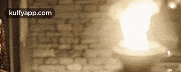 a blurry picture of a brick wall with a light coming out of it