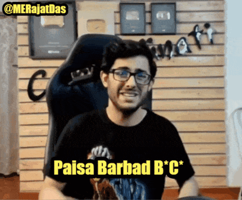 a man wearing glasses and a black shirt with the words paisa barbad b * c * on it