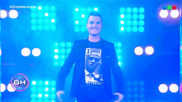 a man wearing a t-shirt with a picture of a man with a x on his head