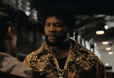 a man wearing a gold chain around his neck