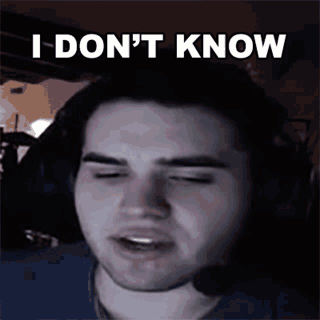 a man wearing headphones is making a funny face and saying `` i don t know '' .