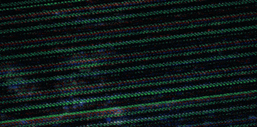 a blurred image of a person standing in front of a screen
