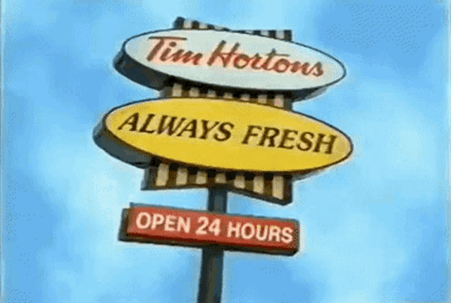a tim hortons sign says that they are open 24 hours