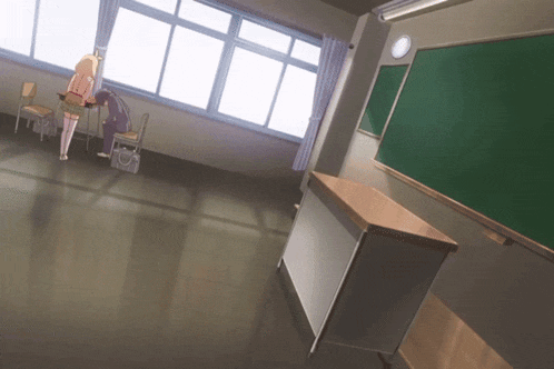 a girl sits at a desk in a classroom with a blackboard