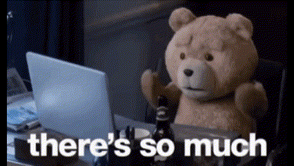 a teddy bear is sitting in front of a laptop computer and says there 's so much