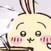 a close up of a cartoon rabbit with a bunny ear holding a plate of food .