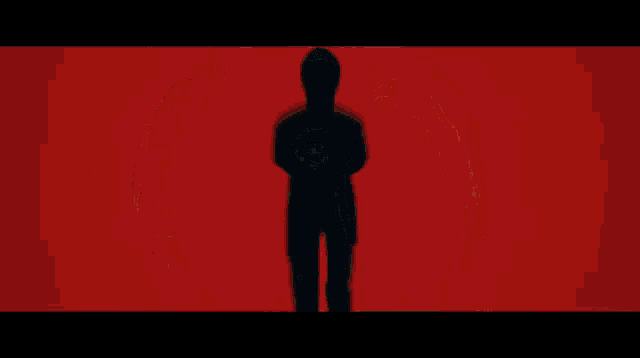 a silhouette of a person is surrounded by a red circle