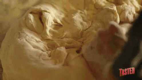 a close up of a piece of dough with taster written on the bottom