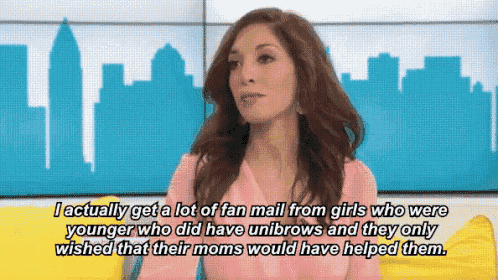 a woman in a pink shirt is talking about getting fan mail from girls who were younger than her