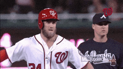 a baseball player with the letter w on his helmet