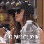 a woman wearing a baseball cap and sunglasses is holding a bottle of water and saying `` this party 's over '' .