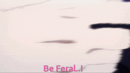a close up of a person 's fist with the words " be feral " above it