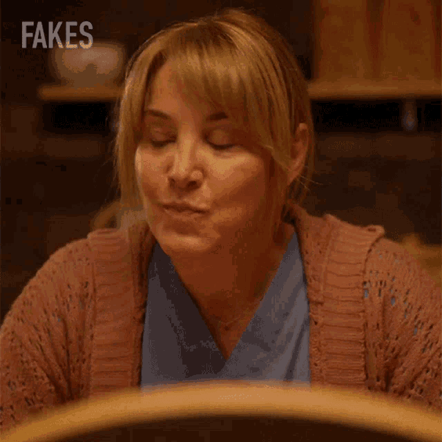 a woman with fakes written on the bottom right
