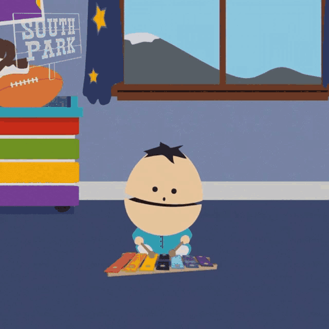 a cartoon character playing a xylophone in front of a south park sign