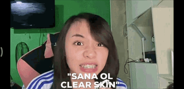 a girl with braces on her teeth is making a funny face and says " sana ol clear skin "