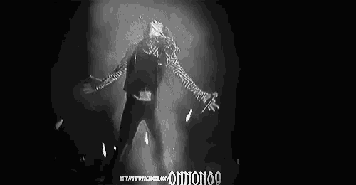 a black and white photo of a person in a zebra print scarf with the words onmonoo on the bottom
