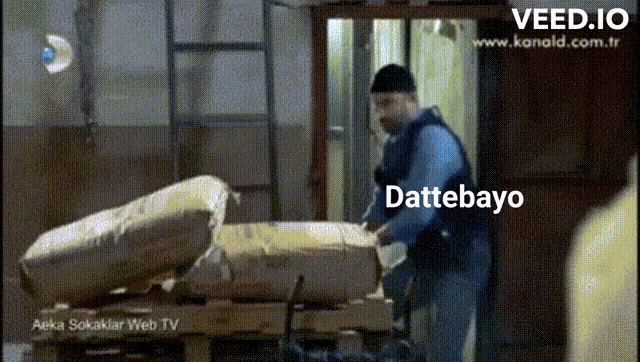 a man is pushing a pallet with a bag that says dettebayo