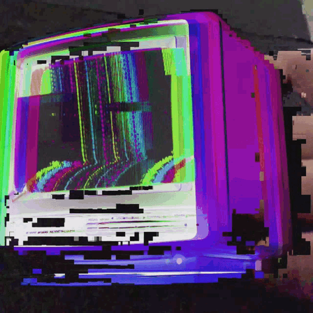 a computer monitor with a rainbow colored screen and a purple border