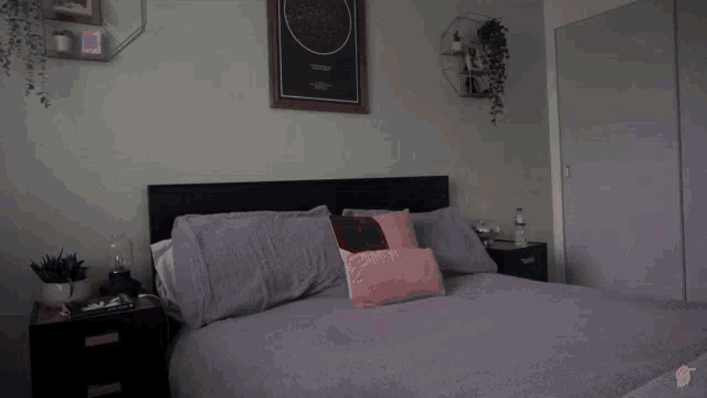 a person is laying on a bed with a picture of a starry night sky above it