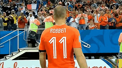 a soccer player with the number 11 on his shirt