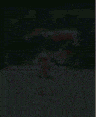 a blurred image of a joker doing a handstand