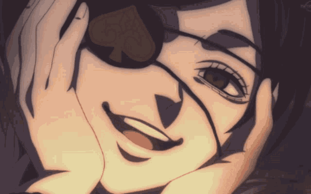 a close up of a person 's face with an ace of spades patch on their eye