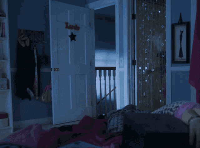 a little girl in a pink tutu is holding a wand in front of a door that says " lexi "