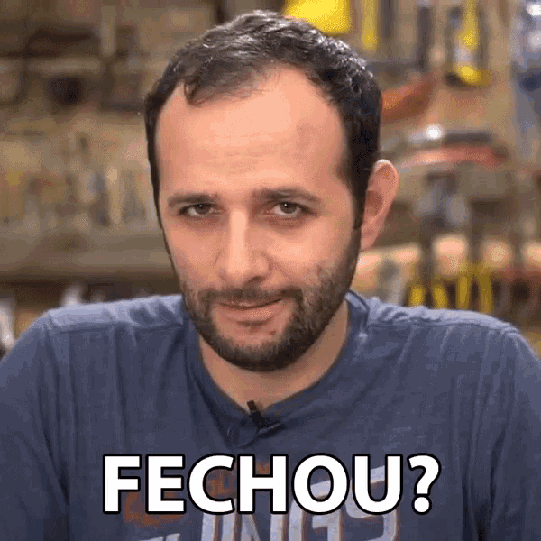 a man with a beard is wearing a blue shirt that says fechou on it