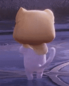 a white cat wearing a yellow hat and scarf is standing on a wooden surface .