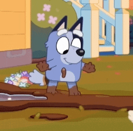 a cartoon dog is standing next to a tree branch .