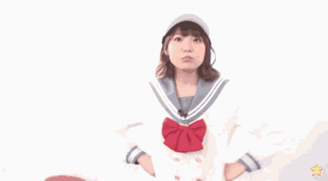 a girl in a sailor suit is wearing a hat that says you