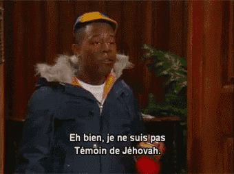 a man in a blue jacket says " eh bien je ne suis pas temoin de jehovah "
