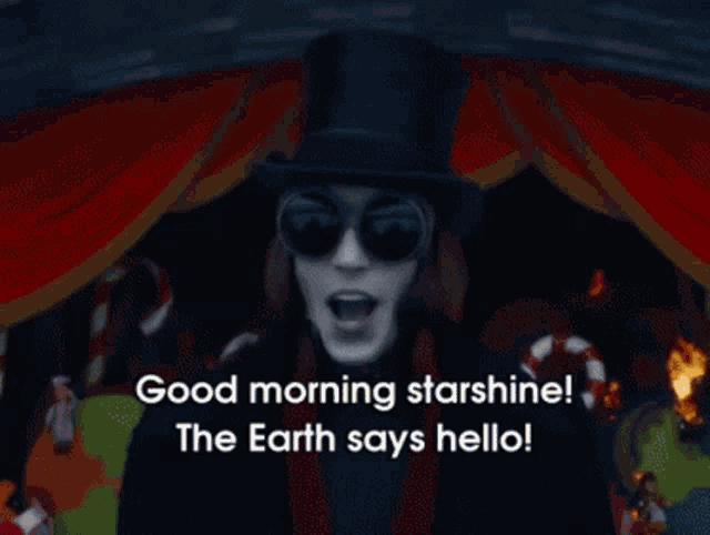 a man in a top hat and sunglasses says good morning starshine