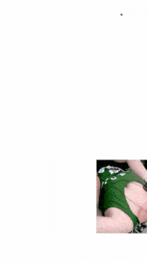 a woman in a green tank top takes a selfie with a caption that says " capcut "