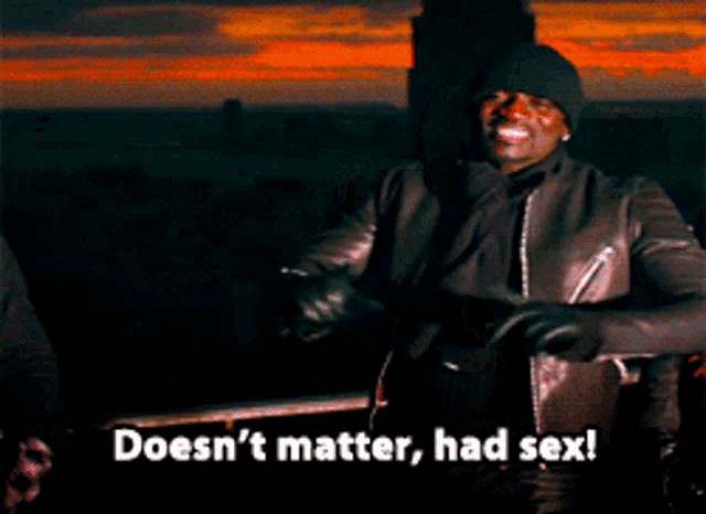 a man in a black jacket says " doesn 't matter had sex " while standing next to another man