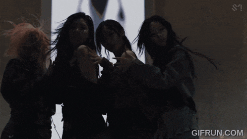 a group of women are hugging each other with the website gifrun.com visible in the corner