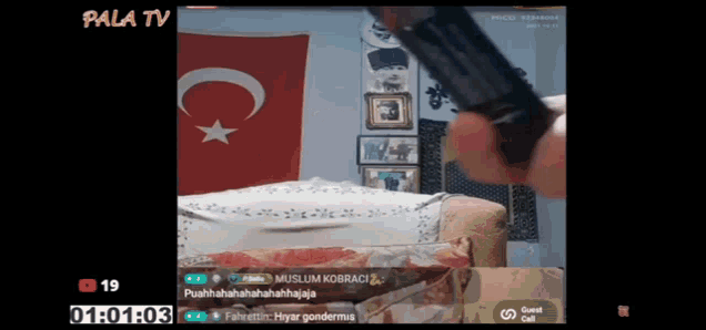 a video of a person holding a gun with the words pala tv on the top