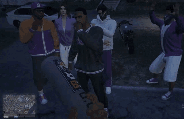 a man wearing a lakers jersey is surrounded by other men