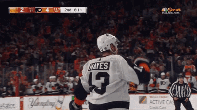 a hockey player wearing a jersey with the number 9 on it