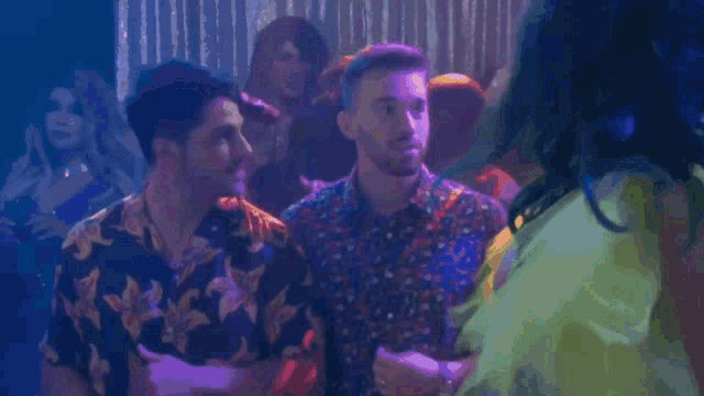 a group of people dancing in front of a sign that says 7f