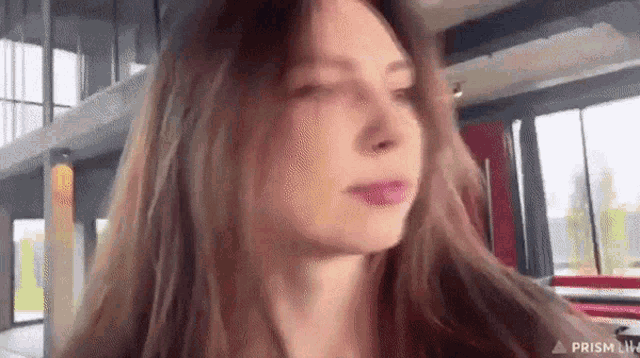 a close up of a woman 's face with her eyes closed