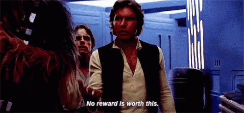 han solo from star wars is standing in a room with chewbacca and luke skywalker .