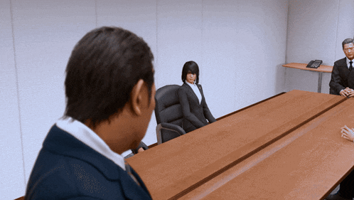 a man and a woman sit at a long wooden table in a meeting room