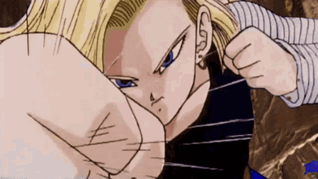 a close up of a cartoon character 's fist with a blue eye