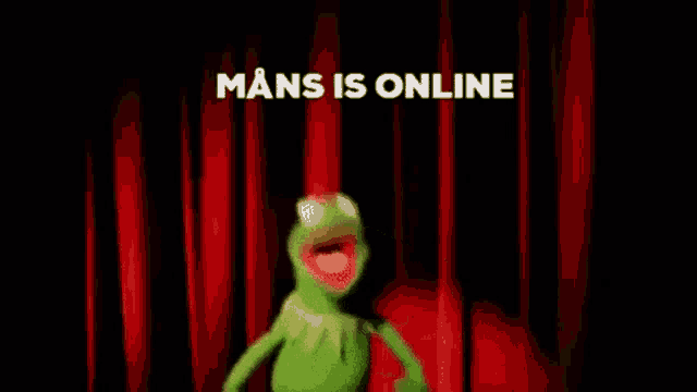 kermit the frog is dancing on a stage in front of a red curtain with the words " mans is online " above him .