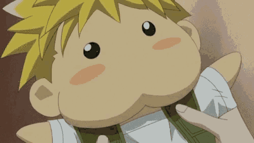 a cartoon character with yellow hair is being held by a hand
